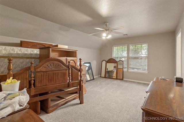 13303 E 95th Pl N, Owasso, OK 74055 - bedroom featuring visible vents, lofted ceiling, baseboards, light colored carpet, and a textured ceiling