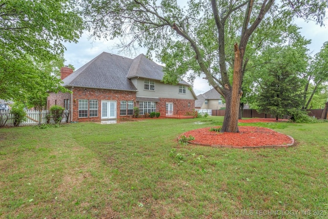 13303 E 95th Pl N, Owasso, OK 74055 - view of yard with french doors and a fenced backyard