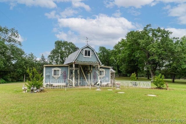 colonial inspired home with fence and a front yard