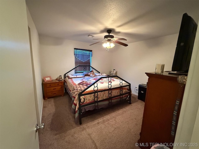 bedroom featuring ceiling fan, carpet, and visible vents