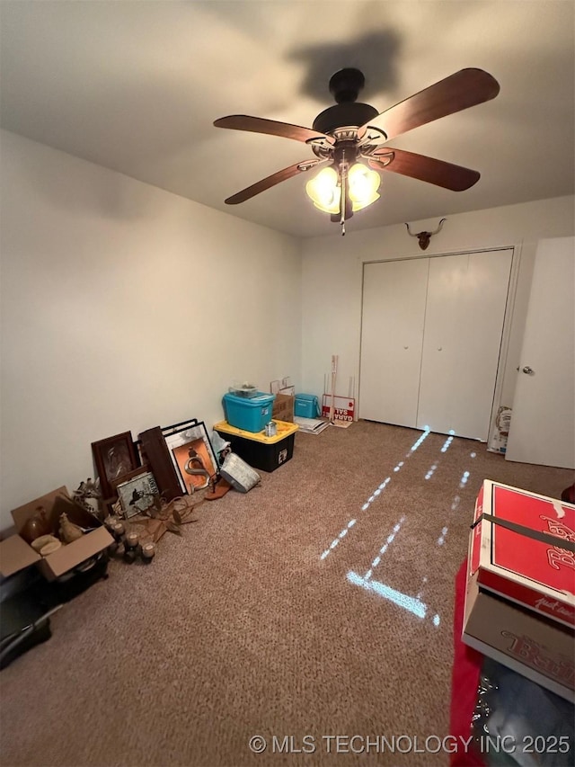 rec room with carpet floors and a ceiling fan