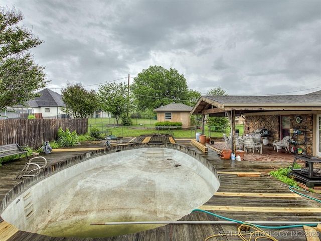 exterior space with fence and a deck