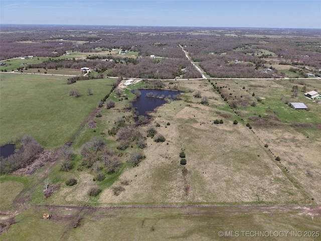 drone / aerial view featuring a water view and a rural view