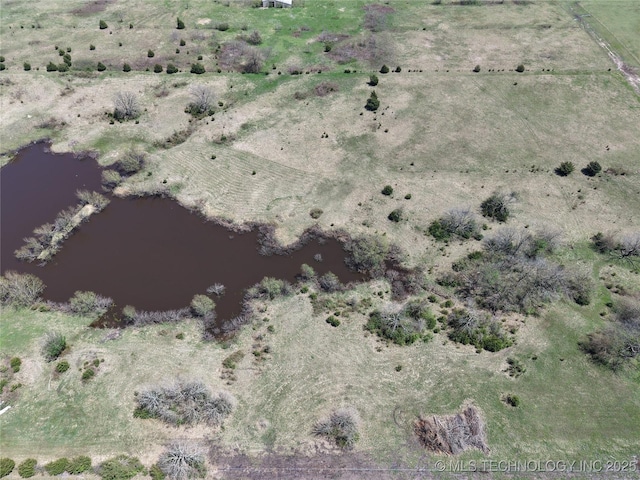 drone / aerial view with a water view and a rural view