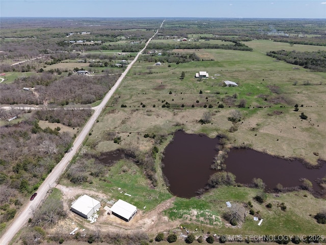 bird's eye view featuring a water view and a rural view