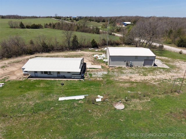 birds eye view of property with a rural view