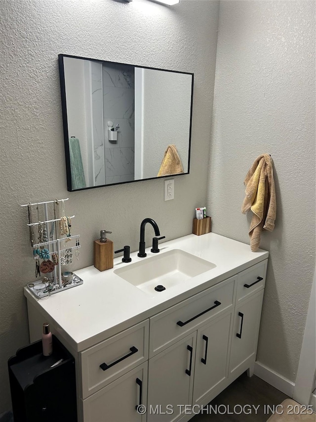 1705 Tower Dr, Ardmore, OK 73401 - bathroom with vanity and a textured wall