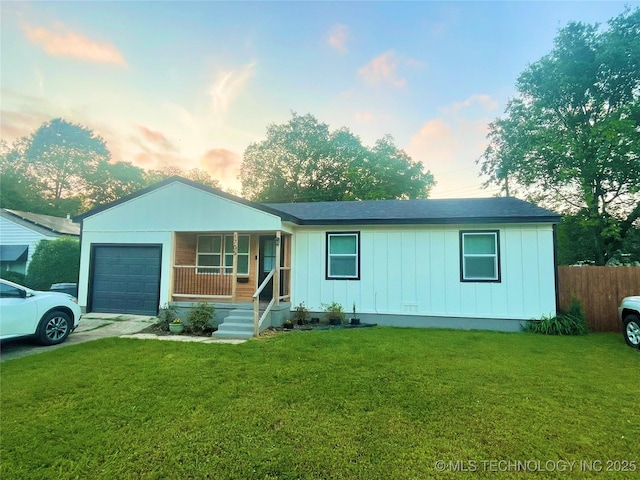 1705 Tower Dr, Ardmore, OK 73401 - view of front facade featuring a garage, covered porch, concrete driveway, and board and batten siding