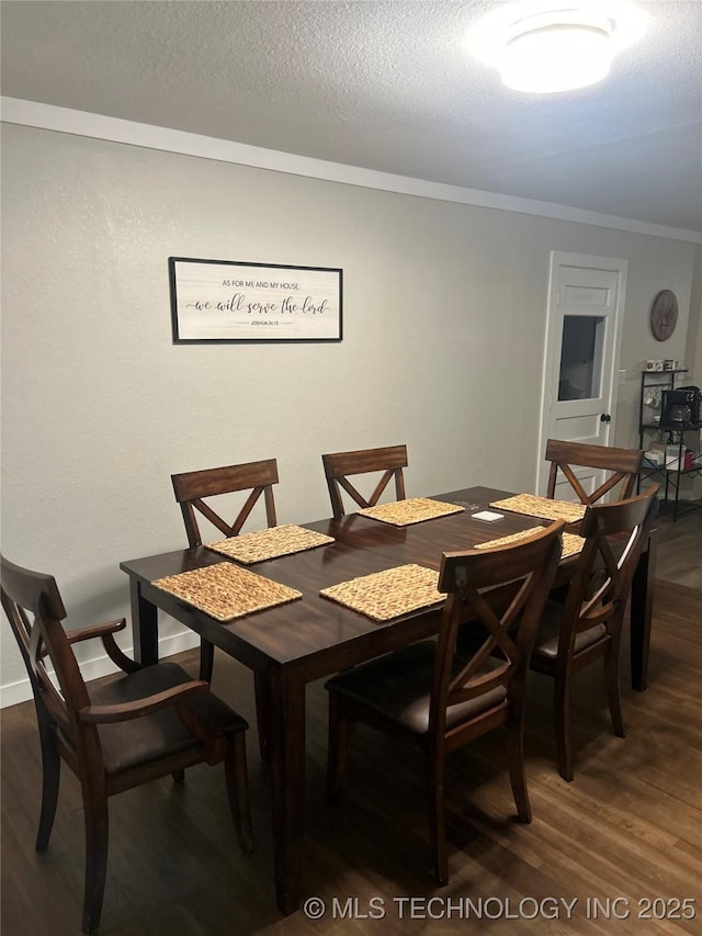 1705 Tower Dr, Ardmore, OK 73401 - dining room featuring crown molding, wood finished floors, and a textured ceiling