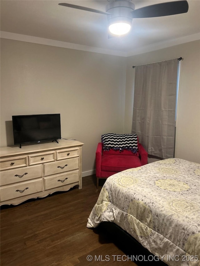 1705 Tower Dr, Ardmore, OK 73401 - bedroom featuring dark wood-style floors, crown molding, a ceiling fan, and baseboards