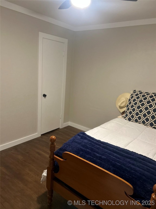 1705 Tower Dr, Ardmore, OK 73401 - bedroom with wood finished floors, baseboards, crown molding, and ceiling fan