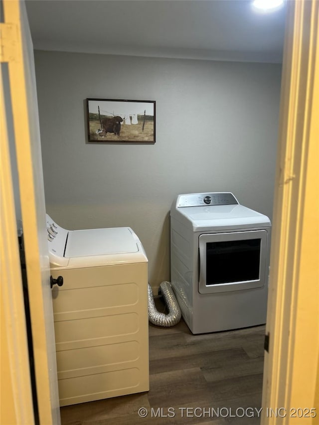 1705 Tower Dr, Ardmore, OK 73401 - washroom with washer and dryer and wood finished floors