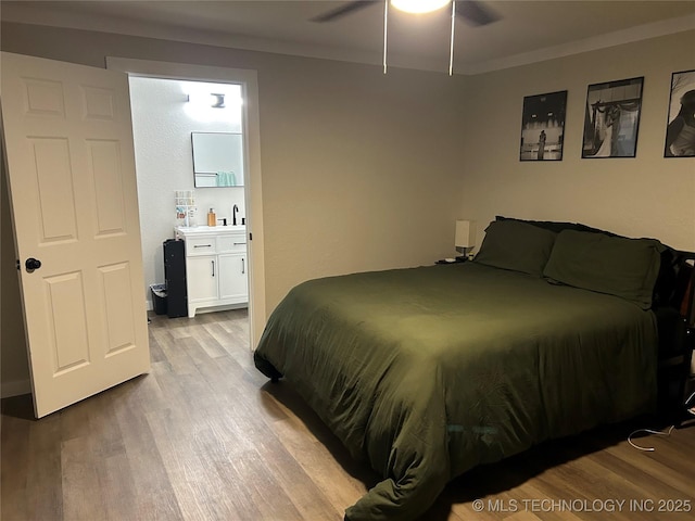 1705 Tower Dr, Ardmore, OK 73401 - bedroom featuring wood finished floors, crown molding, and ceiling fan