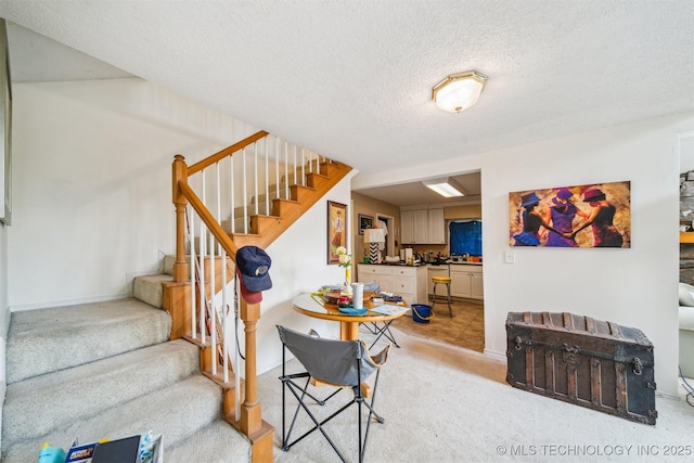 25805 S Clayton Ave, Claremore, OK 74019 - stairway featuring carpet floors, a textured ceiling, and baseboards