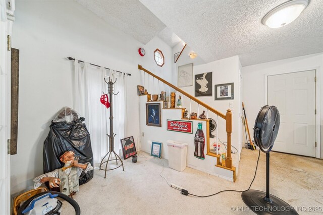 25805 S Clayton Ave, Claremore, OK 74019 - entryway with carpet flooring, stairs, and a textured ceiling
