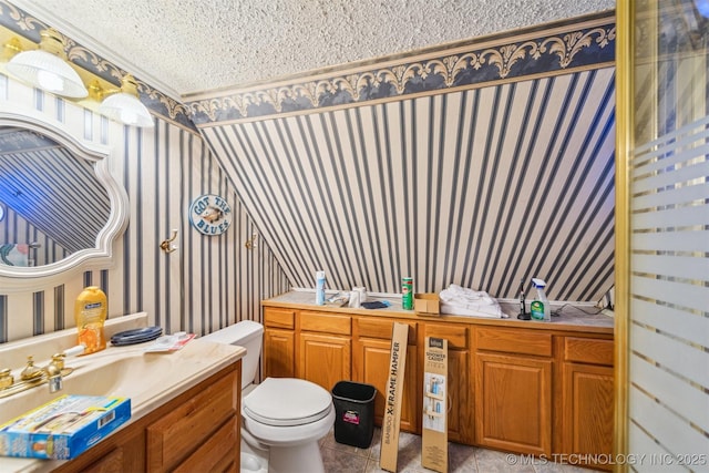 25805 S Clayton Ave, Claremore, OK 74019 - bathroom featuring a textured ceiling, wallpapered walls, toilet, and vanity