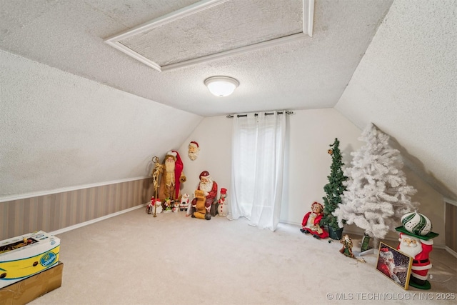 25805 S Clayton Ave, Claremore, OK 74019 - playroom featuring carpet flooring, a textured ceiling, lofted ceiling, and attic access