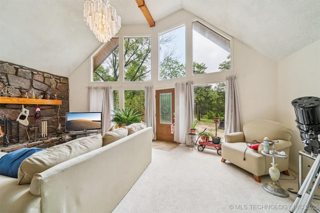 25805 S Clayton Ave, Claremore, OK 74019 - carpeted living area featuring a stone fireplace, a chandelier, and high vaulted ceiling