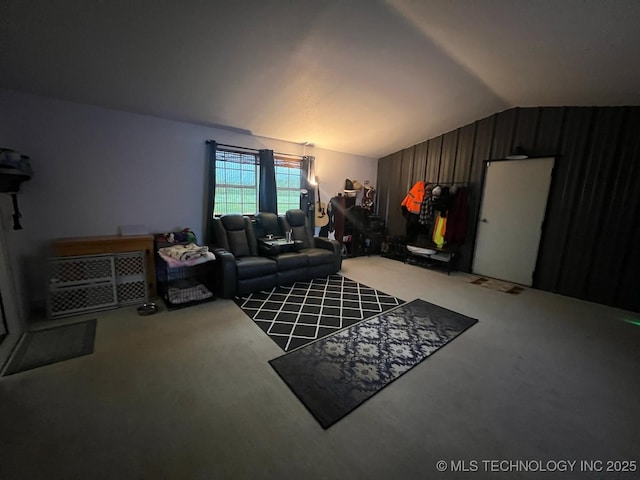 carpeted living area with lofted ceiling