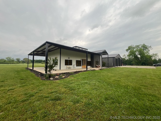 view of home's exterior featuring a patio area and a yard