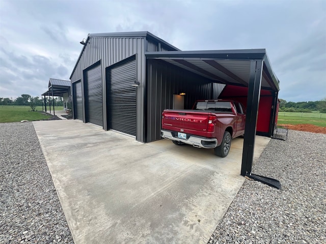 view of vehicle parking featuring concrete driveway and a carport