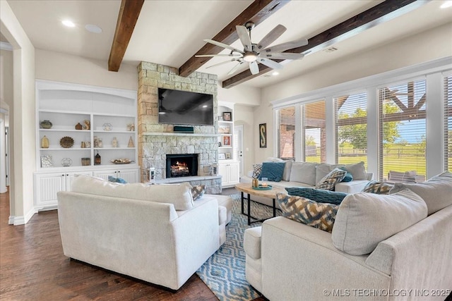 living room with dark wood-style flooring, ceiling fan, beam ceiling, a fireplace, and recessed lighting