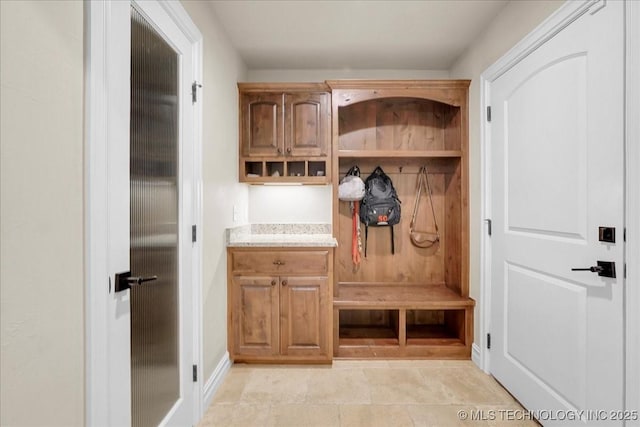 mudroom featuring baseboards