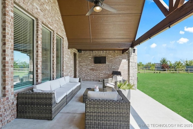 view of patio with fence, a ceiling fan, and an outdoor living space
