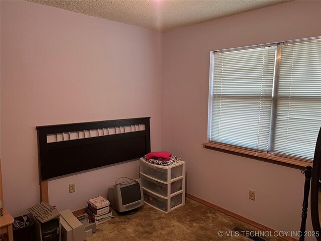 16 B St NW, Inola, OK 74036 - interior space featuring a textured ceiling and carpet
