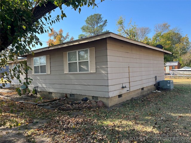 16 B St NW, Inola, OK 74036 - view of home's exterior with central AC unit and crawl space