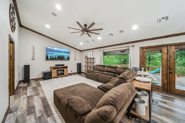 living room with crown molding, ceiling fan, visible vents, and wood finished floors