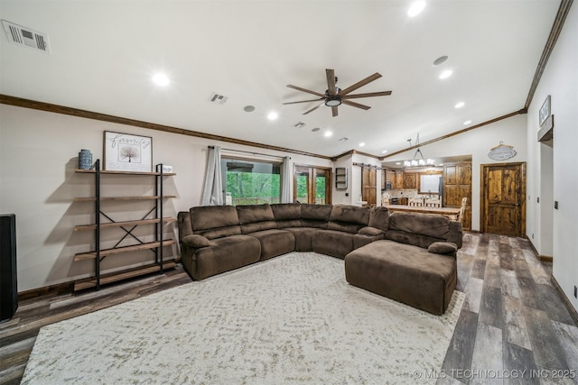 living room with crown molding, a ceiling fan, visible vents, and dark wood-style flooring