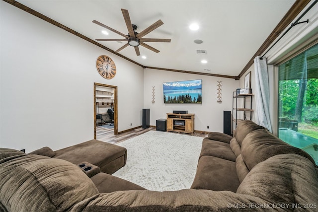 living room with crown molding, visible vents, a ceiling fan, recessed lighting, and vaulted ceiling