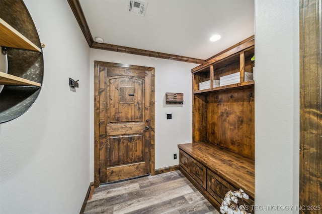 mudroom featuring crown molding, recessed lighting, wood finished floors, and visible vents