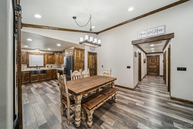 dining room with crown molding, recessed lighting, baseboards, and dark wood-type flooring