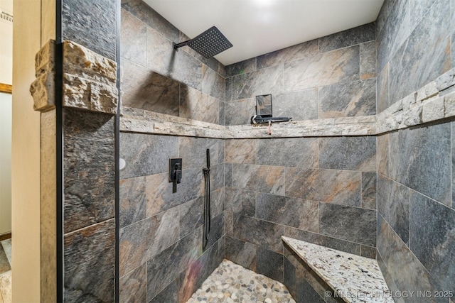bathroom featuring tiled shower