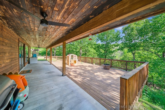 wooden deck featuring ceiling fan