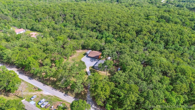 drone / aerial view featuring a view of trees