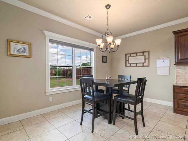 5406 Ashbrook Dr, Bartlesville, OK 74006 - dining room featuring visible vents, ornamental molding, baseboards, and a notable chandelier