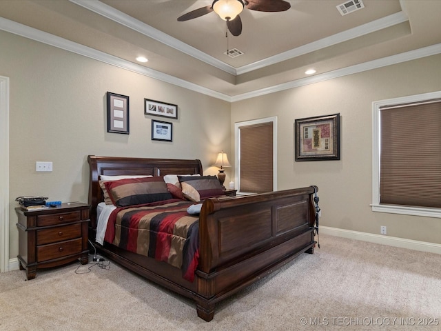 5406 Ashbrook Dr, Bartlesville, OK 74006 - bedroom featuring light colored carpet, a tray ceiling, visible vents, and ornamental molding