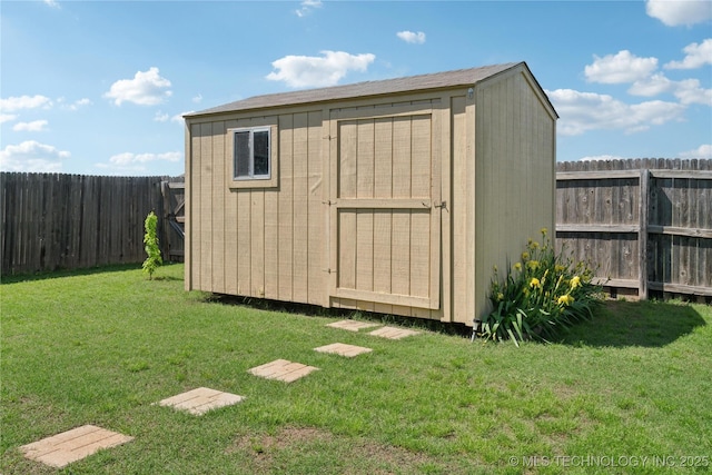 view of shed featuring a fenced backyard