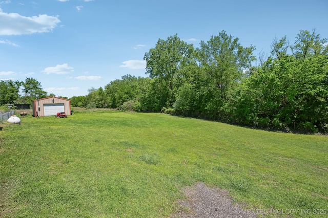 35617 W 261st St S, Bristow, OK 74010 - view of grassy yard with a detached garage and an outbuilding