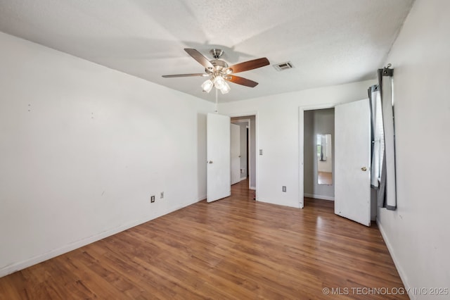35617 W 261st St S, Bristow, OK 74010 - unfurnished bedroom featuring wood finished floors, baseboards, and ceiling fan