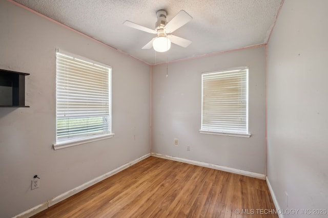35617 W 261st St S, Bristow, OK 74010 - unfurnished room with a textured ceiling, wood finished floors, a ceiling fan, and baseboards