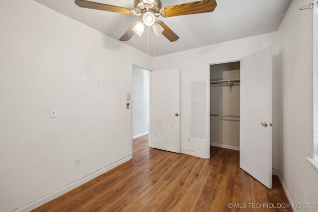 35617 W 261st St S, Bristow, OK 74010 - unfurnished bedroom featuring a closet, wood finished floors, baseboards, and ceiling fan