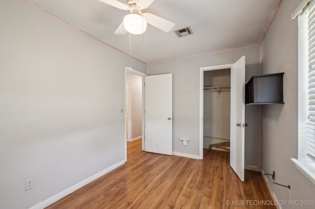 35617 W 261st St S, Bristow, OK 74010 - unfurnished bedroom featuring wood finished floors, a closet, baseboards, and ceiling fan