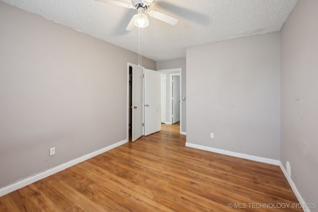35617 W 261st St S, Bristow, OK 74010 - unfurnished room featuring a textured ceiling, a ceiling fan, light wood-style flooring, and baseboards