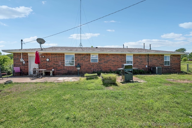 35617 W 261st St S, Bristow, OK 74010 - rear view of house featuring a patio, brick siding, and central AC