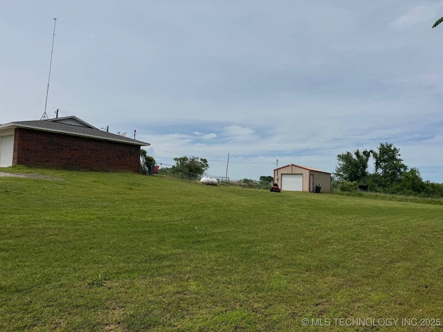 35617 W 261st St S, Bristow, OK 74010 - view of green lawn featuring a garage and an outdoor structure