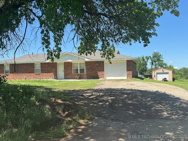 35617 W 261st St S, Bristow, OK 74010 - single story home with brick siding, driveway, a garage, and a front yard